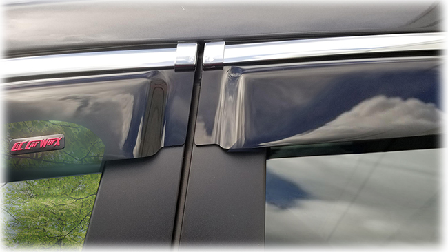 Shown is a close-up of the two-door abutment of the window visors on a 2020 model of Subaru Ascent: Set of four WV-19A-TF Tape-On Outside-Mount Window Visor Rain Guards With Chrome-Style Accent Trim to complement your model's OEM design and fit 2019, 2020, 2021, 2022 Subaru Ascent