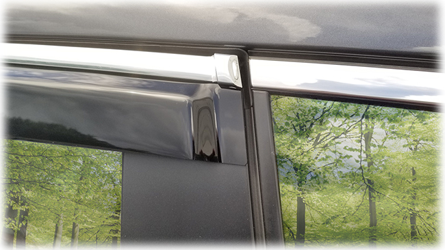 Shown is a close-up of rear edge of window visor on a 2020 model: Set of four WV-19A-TF Tape-On Outside-Mount Window Visor Rain Guards With Chrome-Style Accent Trim to complement your model's OEM design and fit 2019, 2020, 2021, 2022 Subaru Ascent