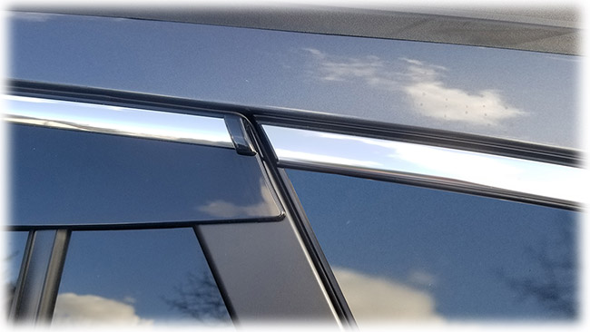 Shown is a close-up of rear edge of high quality Injection-Molded window visor WV-O20-TFI Tape-On Outside-Mount Window Visor Rain Guards With Chrome-Style Accent Trim to complement your model's OEM design and fit 2020, 2021, 2022 Subaru Outback Wagon