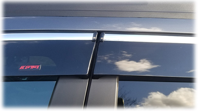 Shown is a close-up of the precision-fitting door butt of high quality Injection-Molded window visor WV-O20-TFI Tape-On Outside-Mount Window Visor Rain Guards With Chrome-Style Accent Trim to complement your model's OEM design and fit 2020, 2021, 2022 Subaru Outback Wagon