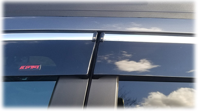 Shown is a close-up of the precision-fitting door butt of high quality Injection-Molded window visor WV-O20-TFI Tape-On Outside-Mount Window Visor Rain Guards With Chrome-Style Accent Trim to complement your model's OEM design and fit 2020, 2021, 2022, 2023, 2024 Subaru Outback Wagon